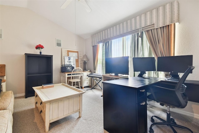 carpeted office space featuring lofted ceiling and ceiling fan