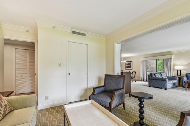 living area with crown molding and carpet