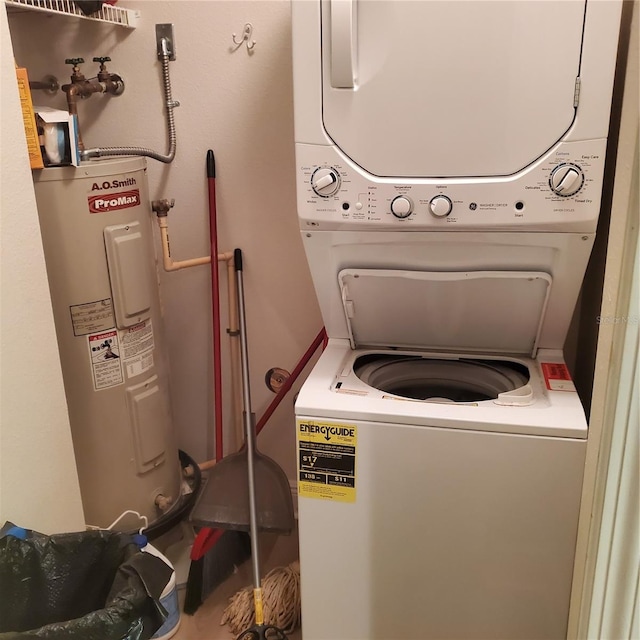 washroom with stacked washer and dryer and electric water heater