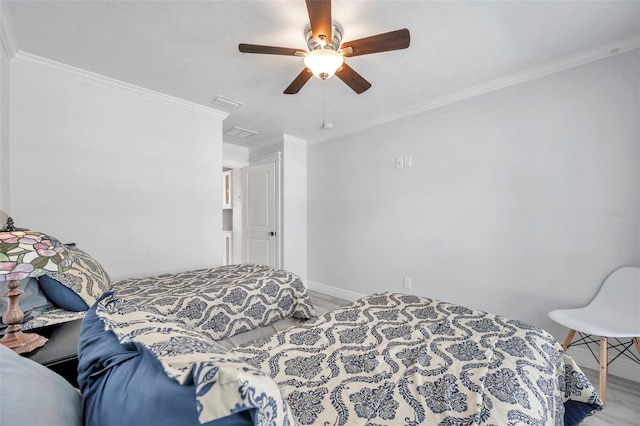 bedroom featuring ceiling fan, ornamental molding, and wood-type flooring