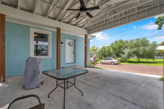 view of patio featuring ceiling fan