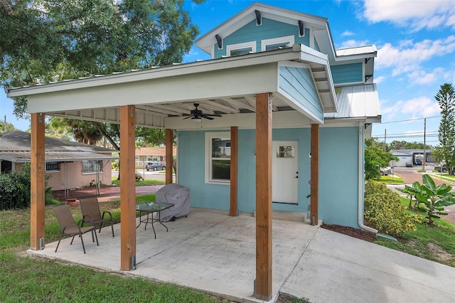 view of patio / terrace with ceiling fan and grilling area