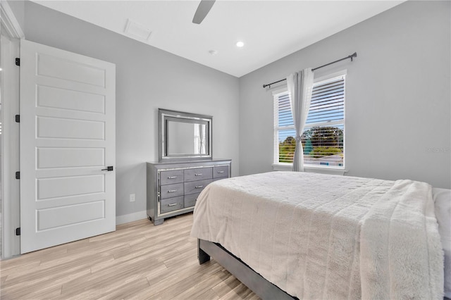 bedroom featuring light hardwood / wood-style floors and ceiling fan