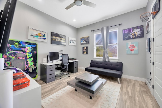 home office with ceiling fan and hardwood / wood-style floors