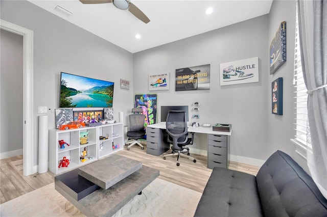 office featuring light wood-type flooring and ceiling fan