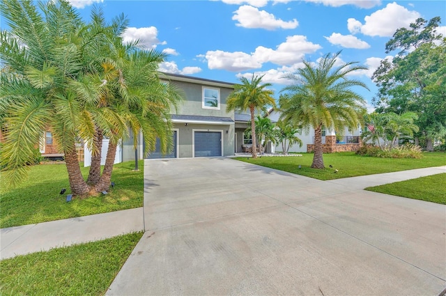 view of front of home with a garage and a front lawn