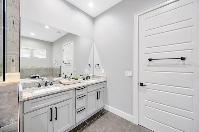 bathroom featuring tile patterned flooring and vanity