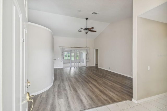 interior space featuring lofted ceiling, light hardwood / wood-style flooring, and ceiling fan