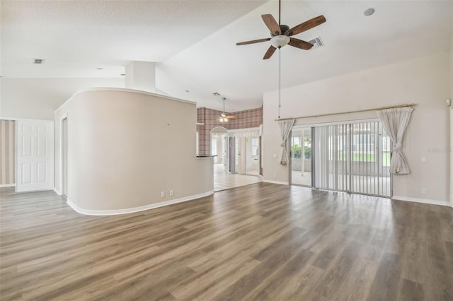 unfurnished living room featuring high vaulted ceiling, hardwood / wood-style floors, ceiling fan, and a textured ceiling