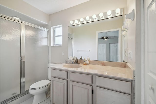 bathroom with walk in shower, vanity, ceiling fan, and toilet