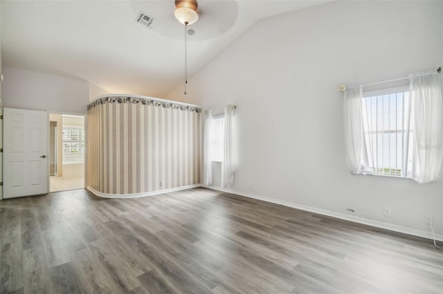 spare room with ceiling fan, high vaulted ceiling, and hardwood / wood-style flooring