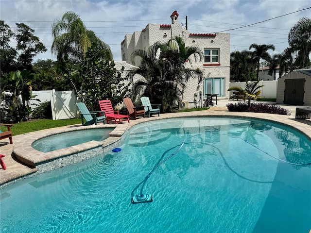 view of swimming pool with a shed