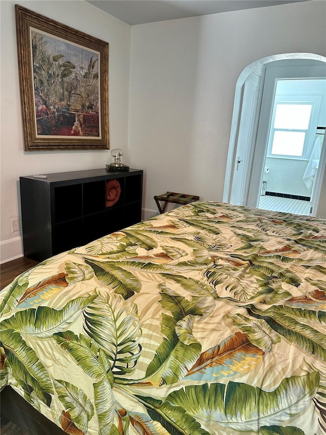 bedroom with wood-type flooring