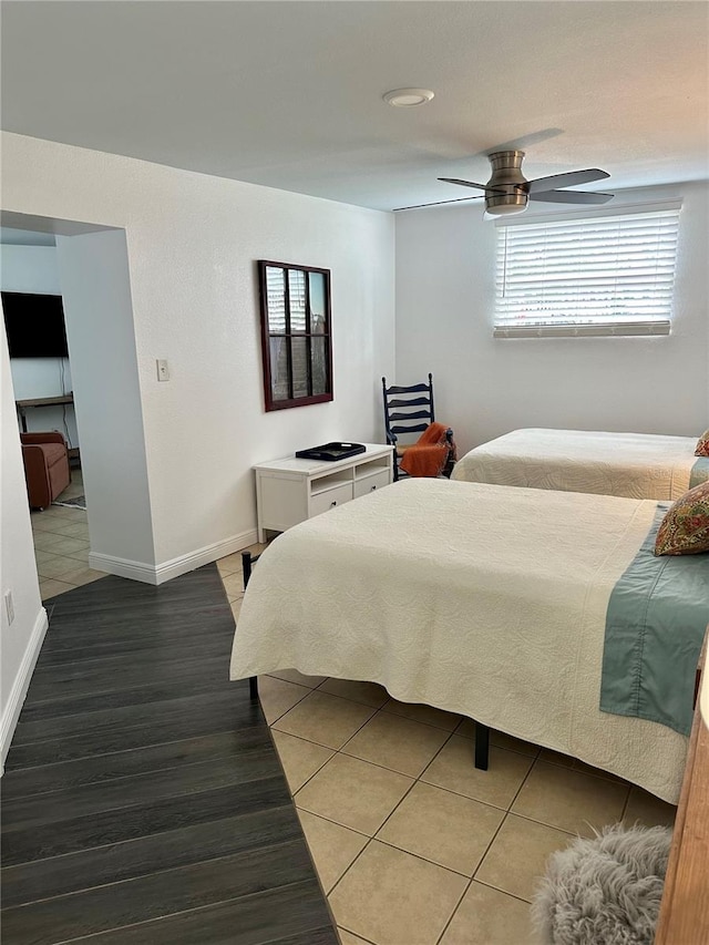 bedroom featuring hardwood / wood-style floors and ceiling fan