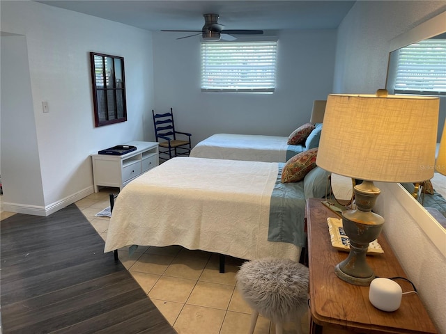 bedroom with ceiling fan and light hardwood / wood-style floors