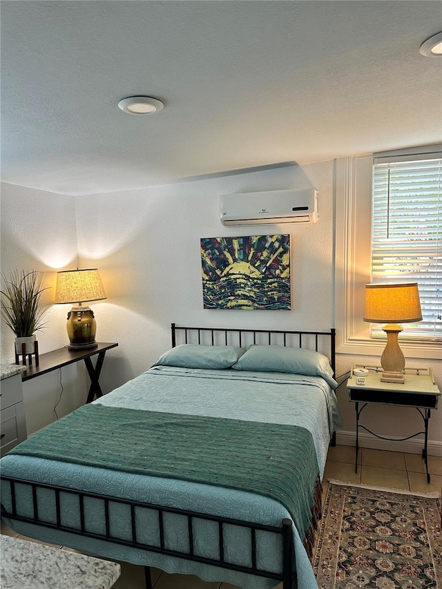 tiled bedroom with a wall mounted AC