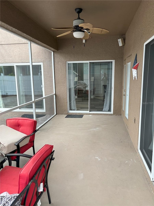 view of patio featuring ceiling fan