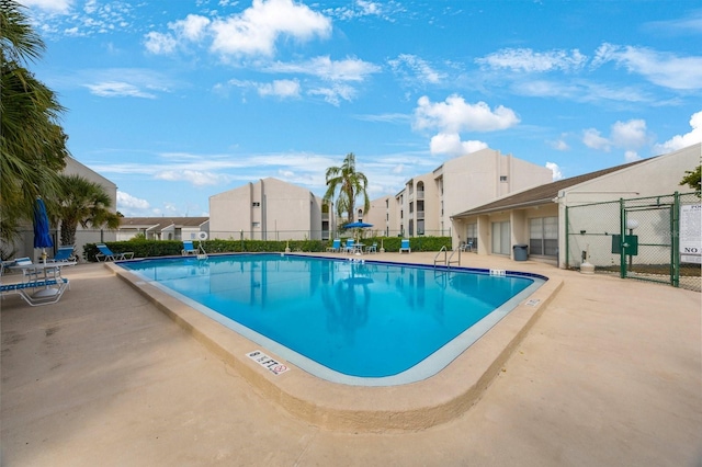 view of swimming pool with a patio