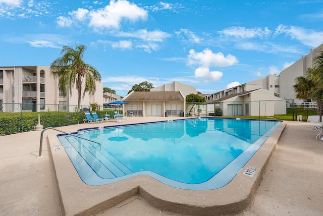 view of swimming pool with a patio area