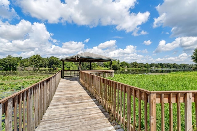 view of home's community with a gazebo and a water view