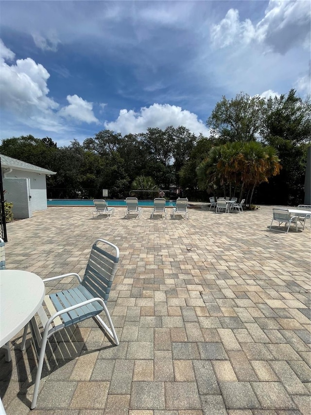 view of patio featuring a community pool