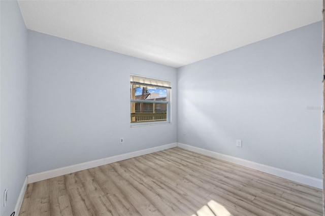 unfurnished room featuring light wood-type flooring