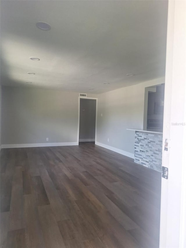 unfurnished room featuring hardwood / wood-style floors