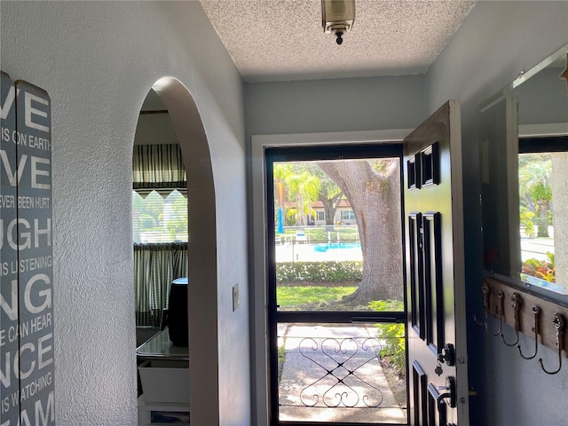 entrance foyer featuring a textured ceiling