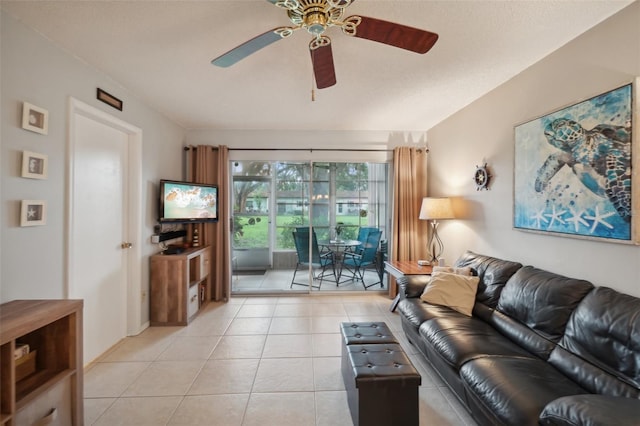 living room featuring ceiling fan and light tile patterned flooring