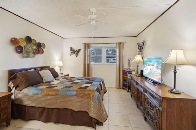 tiled bedroom featuring ceiling fan and a textured ceiling