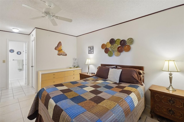 tiled bedroom featuring ceiling fan and a textured ceiling