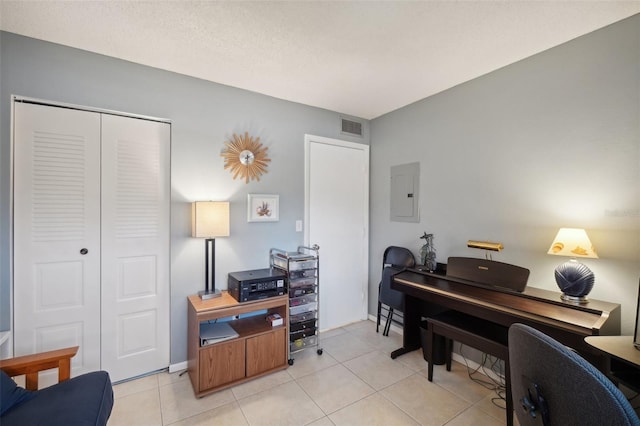 tiled office space with electric panel