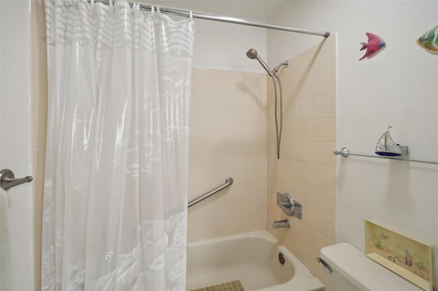 bathroom featuring toilet and shower / bathtub combination with curtain