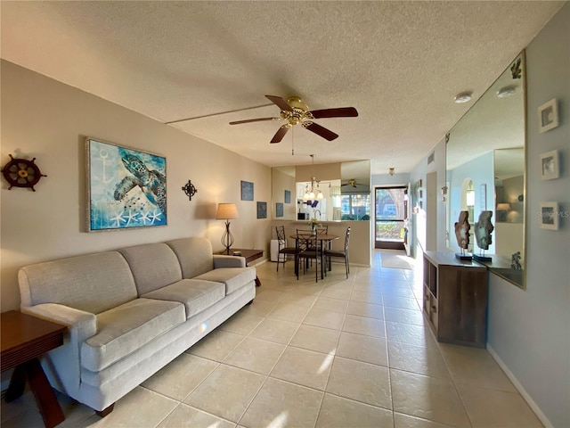 tiled living room featuring ceiling fan and a textured ceiling