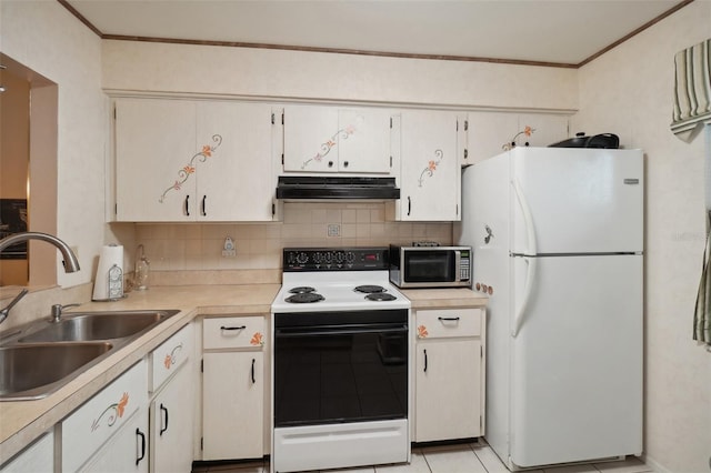 kitchen featuring range with electric cooktop, tasteful backsplash, white cabinetry, sink, and white fridge