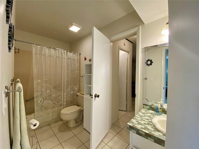 full bathroom with vanity, tile patterned floors, shower / bath combination with curtain, and toilet