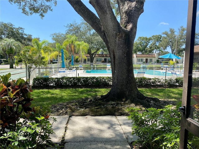 view of yard featuring a community pool