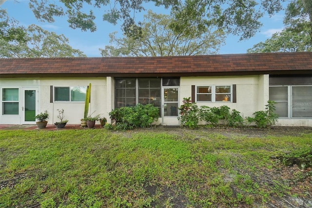 exterior space featuring a front lawn