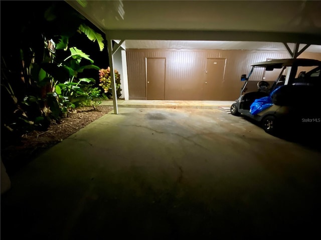 garage featuring a carport