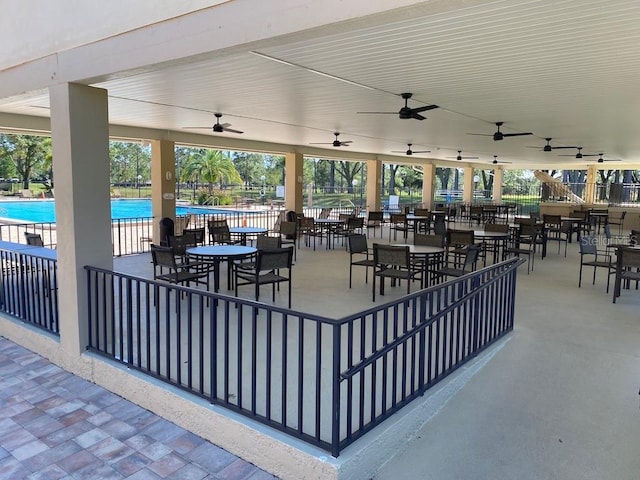 view of patio / terrace featuring a community pool and ceiling fan