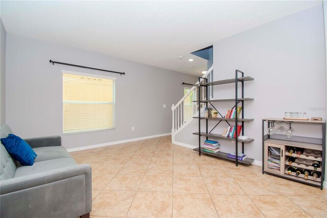 sitting room featuring light tile patterned flooring