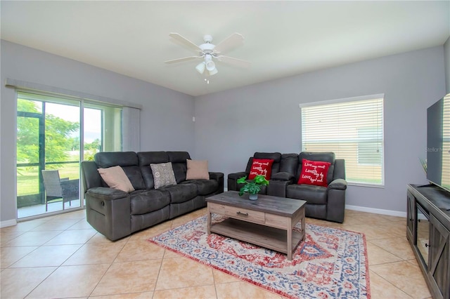 tiled living room featuring plenty of natural light and ceiling fan