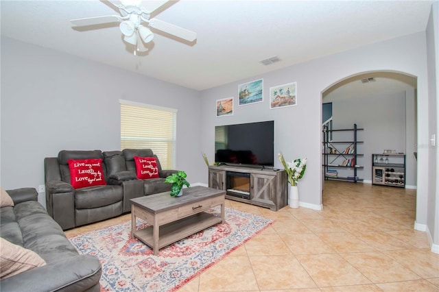 living room featuring ceiling fan and light tile patterned flooring