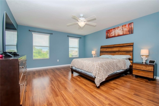 bedroom featuring wood-type flooring and ceiling fan