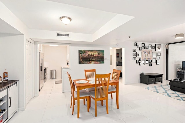 dining room with light tile patterned flooring