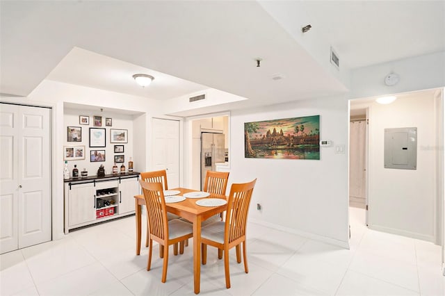 tiled dining space with electric panel