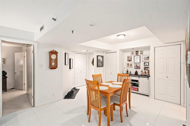 dining space with light tile patterned floors