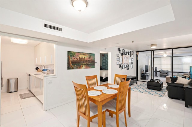 dining area featuring light tile patterned floors