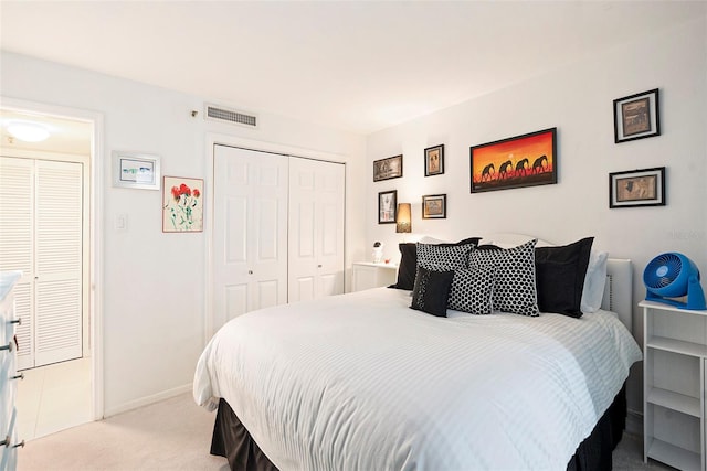 carpeted bedroom featuring a closet