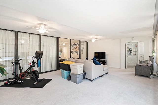 living room featuring light carpet and ceiling fan